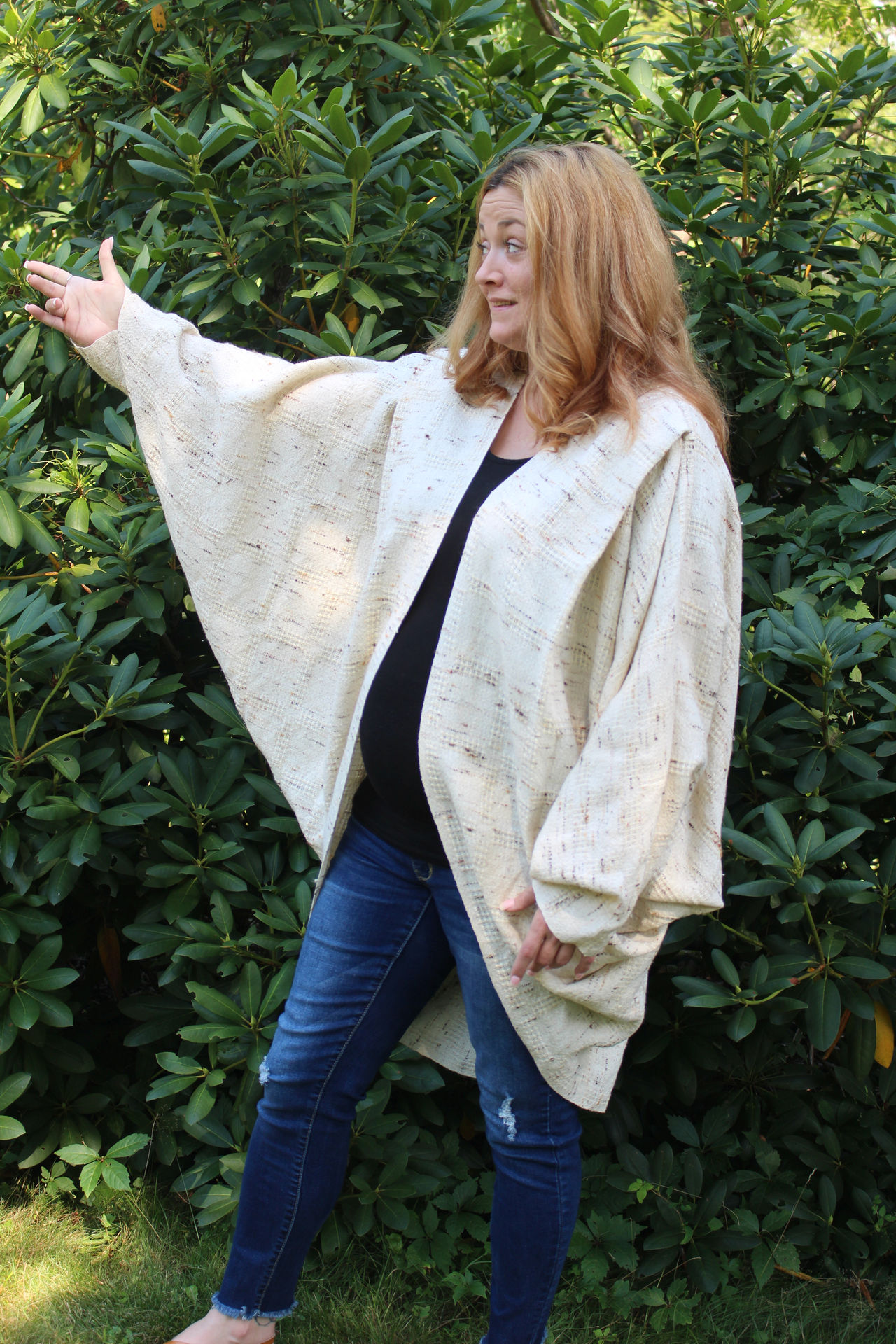 Woman wearing a cream cocoon, front view