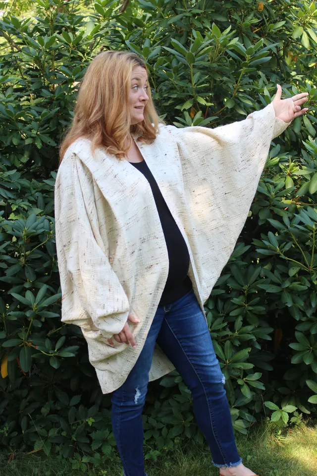 Woman wearing a cream cocoon, front view
